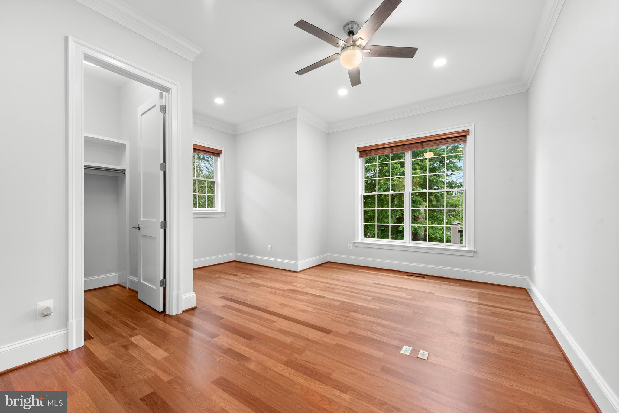 7003 Churchill Road McLean, VA 22101 - Photo 12 of 76 wooden floor in an empty room with a window