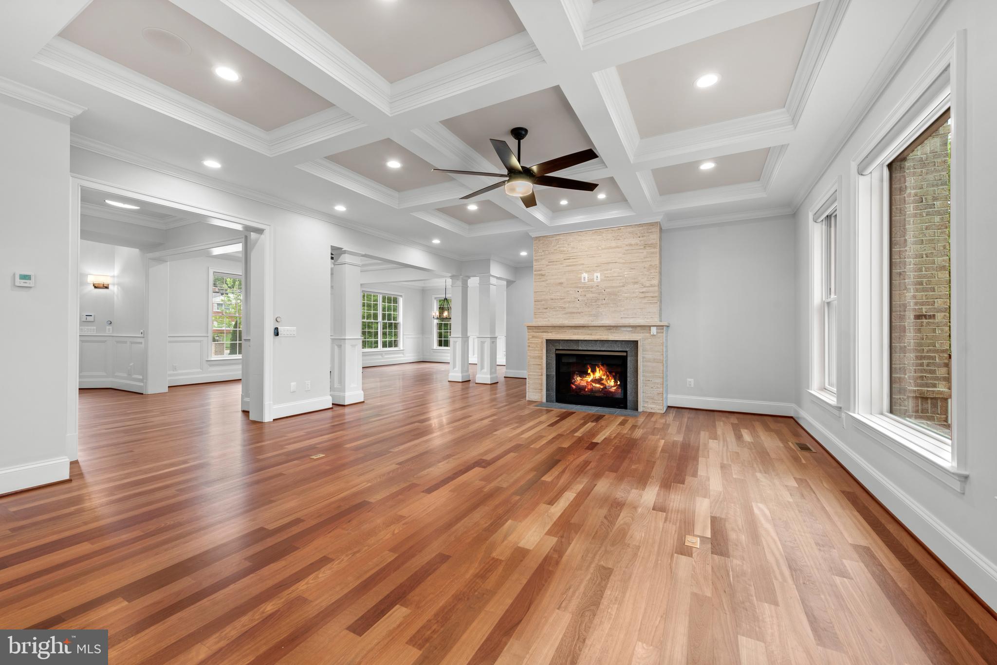 7003 Churchill Road McLean, VA 22101 - Photo 17 of 76 a view of an empty room with wooden floor fireplace and a window