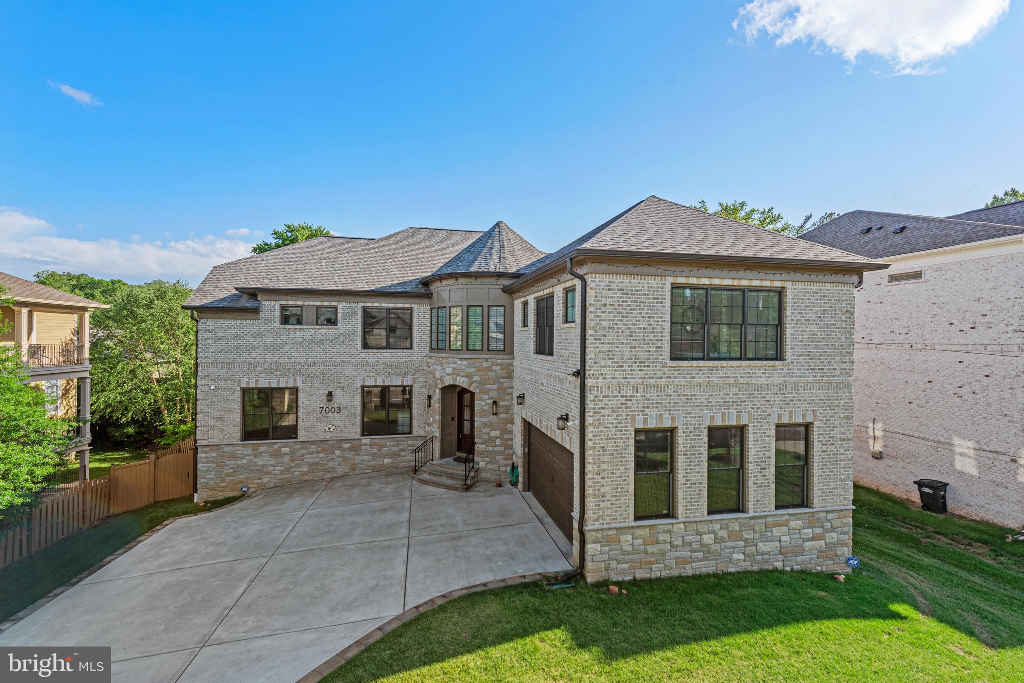 7003 Churchill Road McLean, VA 22101 - Photo 2 of 76 a front view of a house with a garden