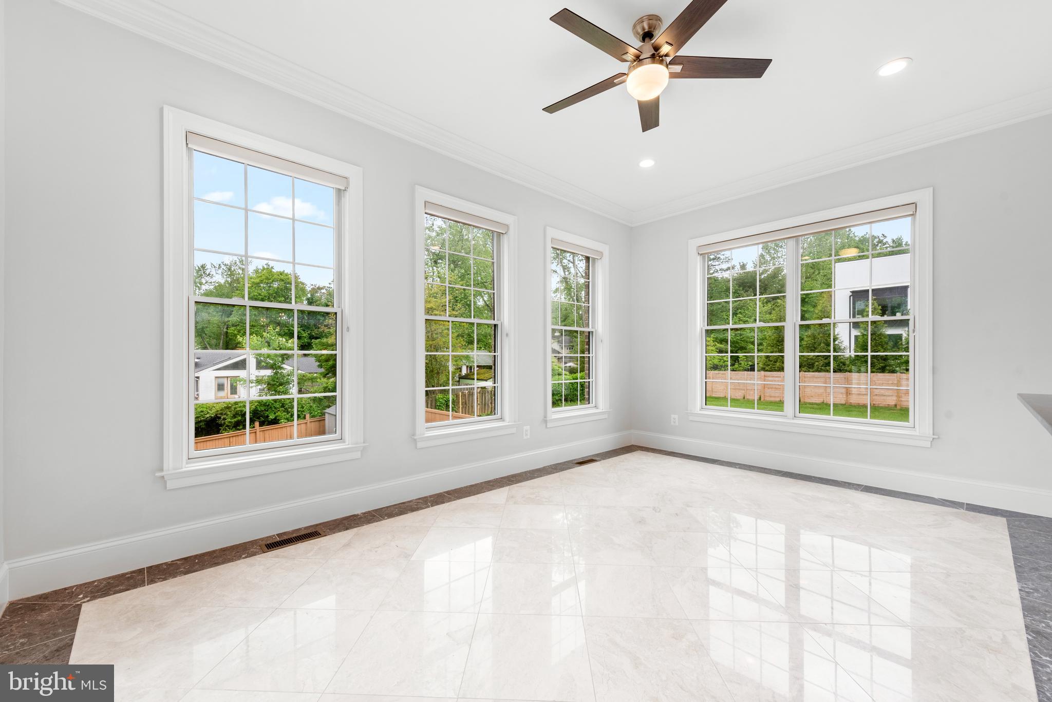 7003 Churchill Road McLean, VA 22101 - Photo 26 of 76 a view of an empty room with a window and kitchen view