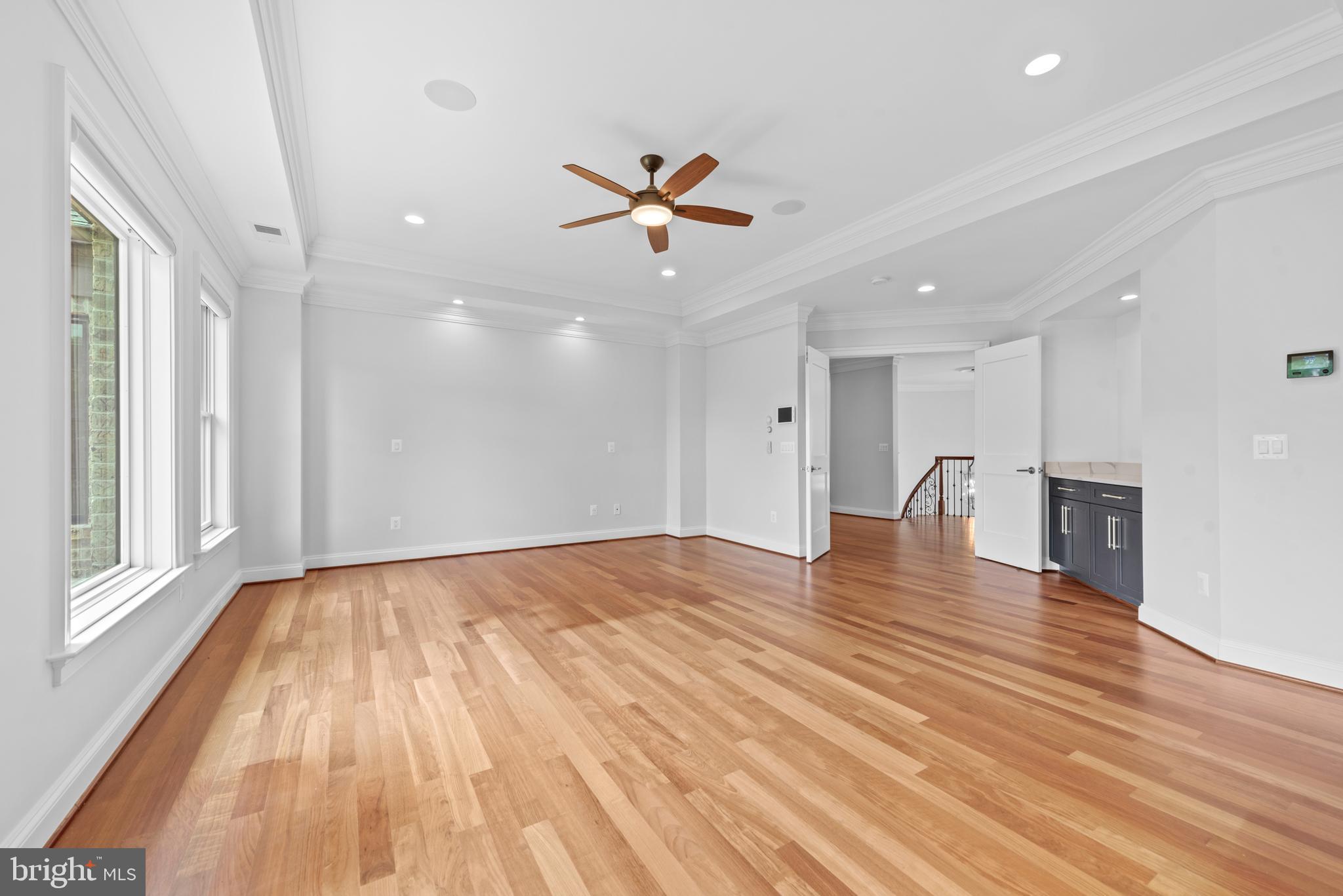 7003 Churchill Road McLean, VA 22101 - Photo 37 of 76 a view of a room with a ceiling fan hardwood floor and a ceiling fan