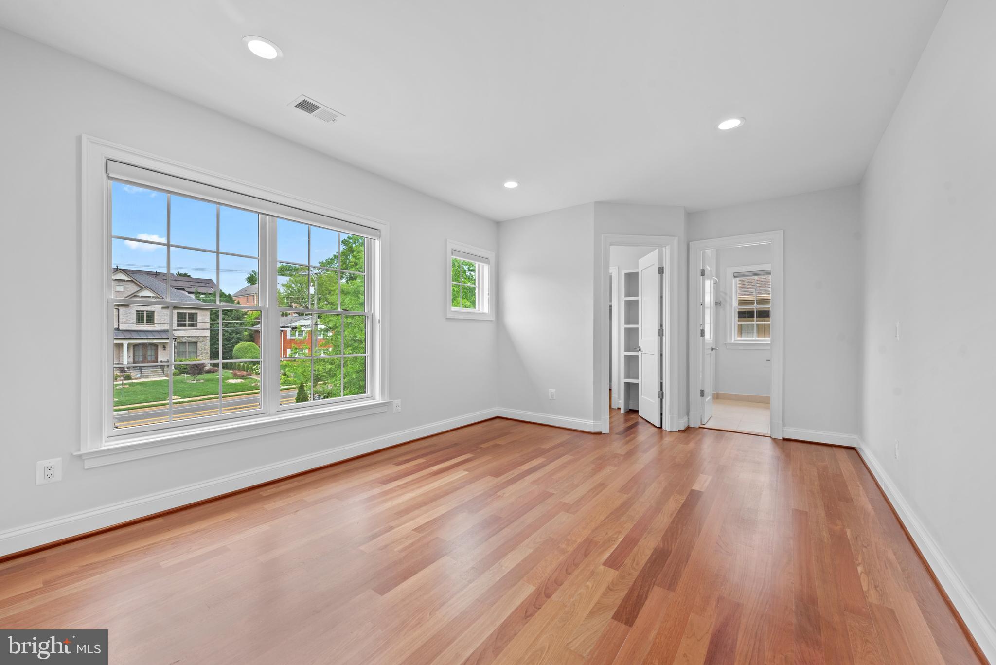 7003 Churchill Road McLean, VA 22101 - Photo 45 of 76 wooden floor in an empty room with a window