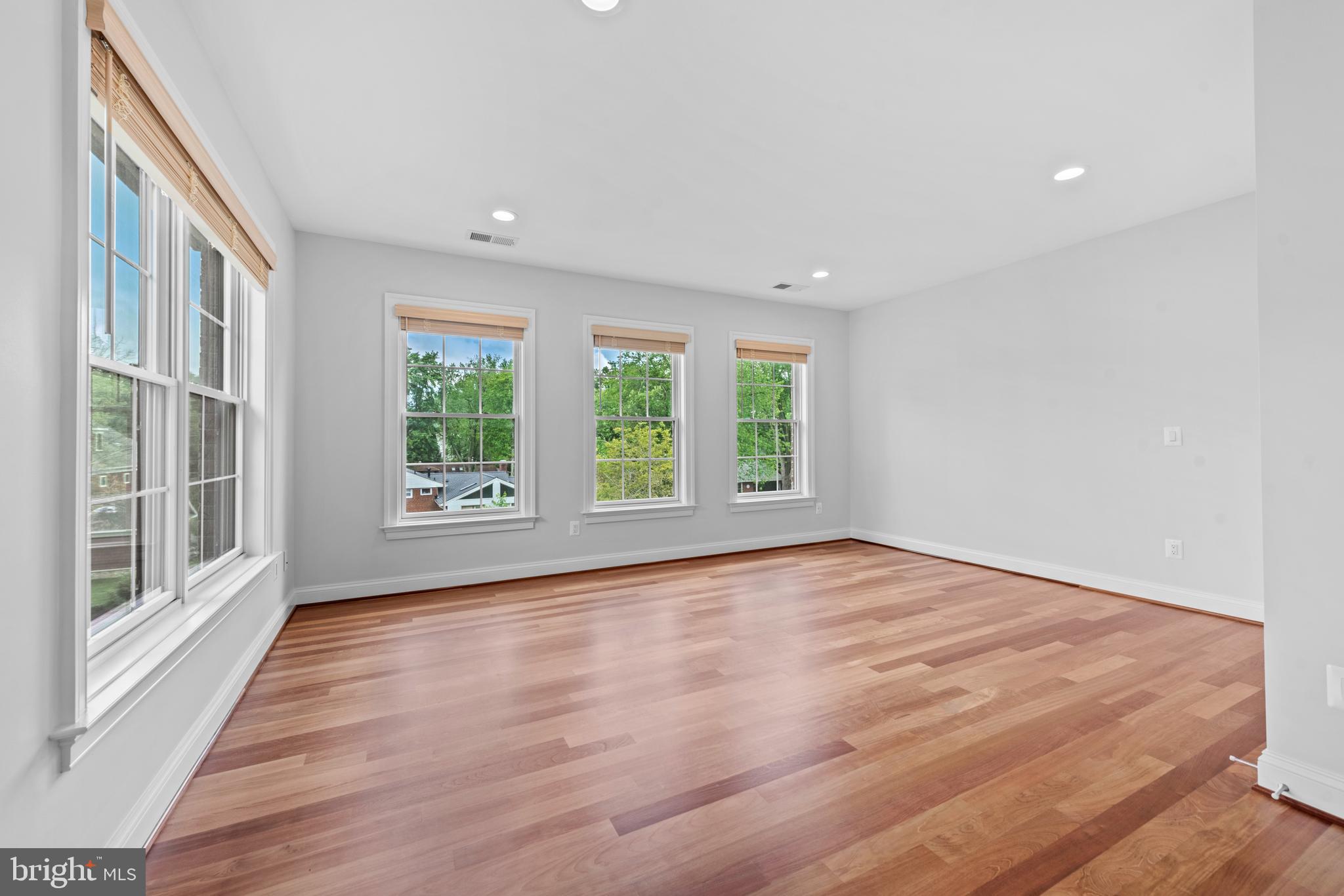 7003 Churchill Road McLean, VA 22101 - Photo 47 of 76 a view of an empty room with wooden floor and a window