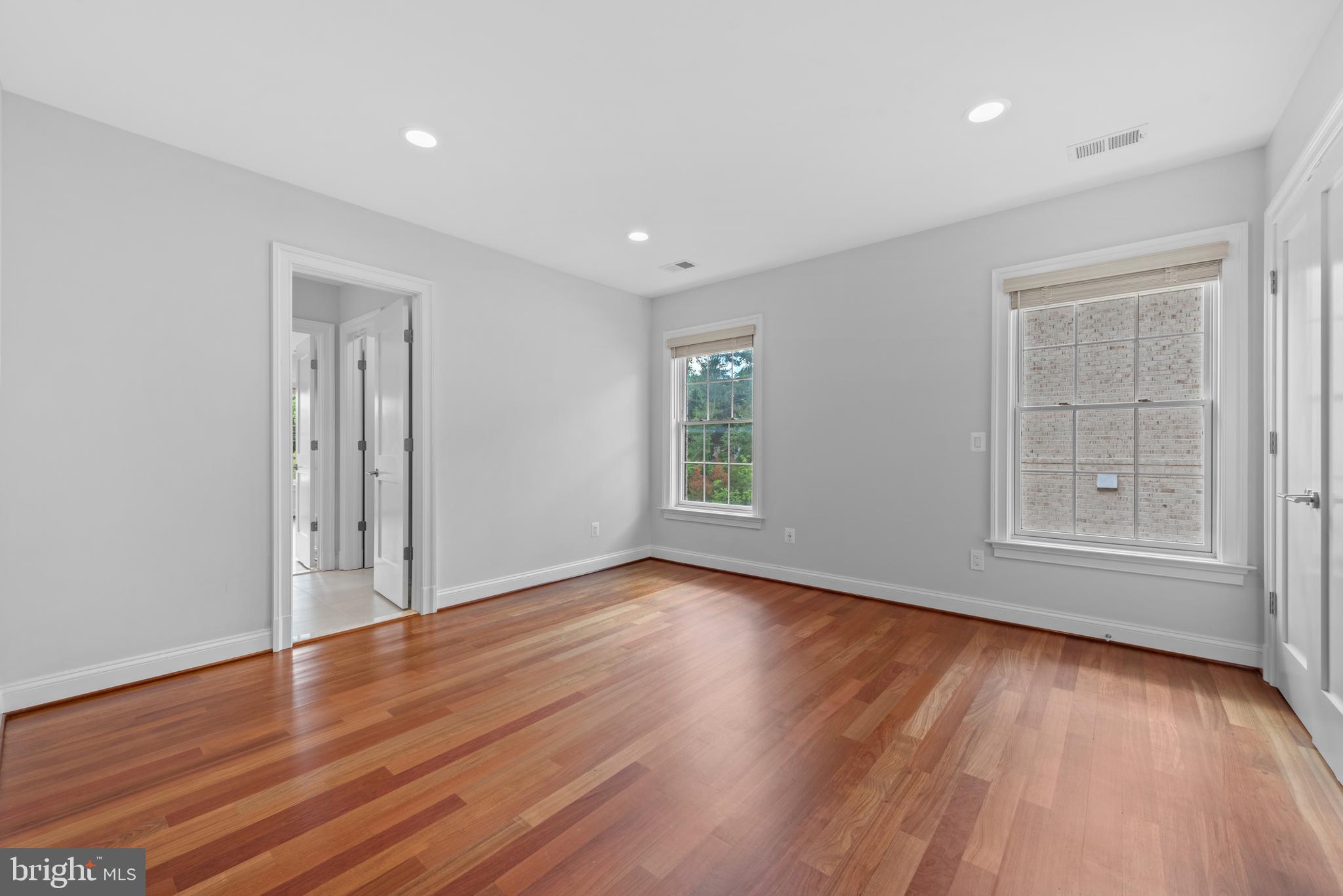 7003 Churchill Road McLean, VA 22101 - Photo 51 of 76 an empty room with wooden floor and windows