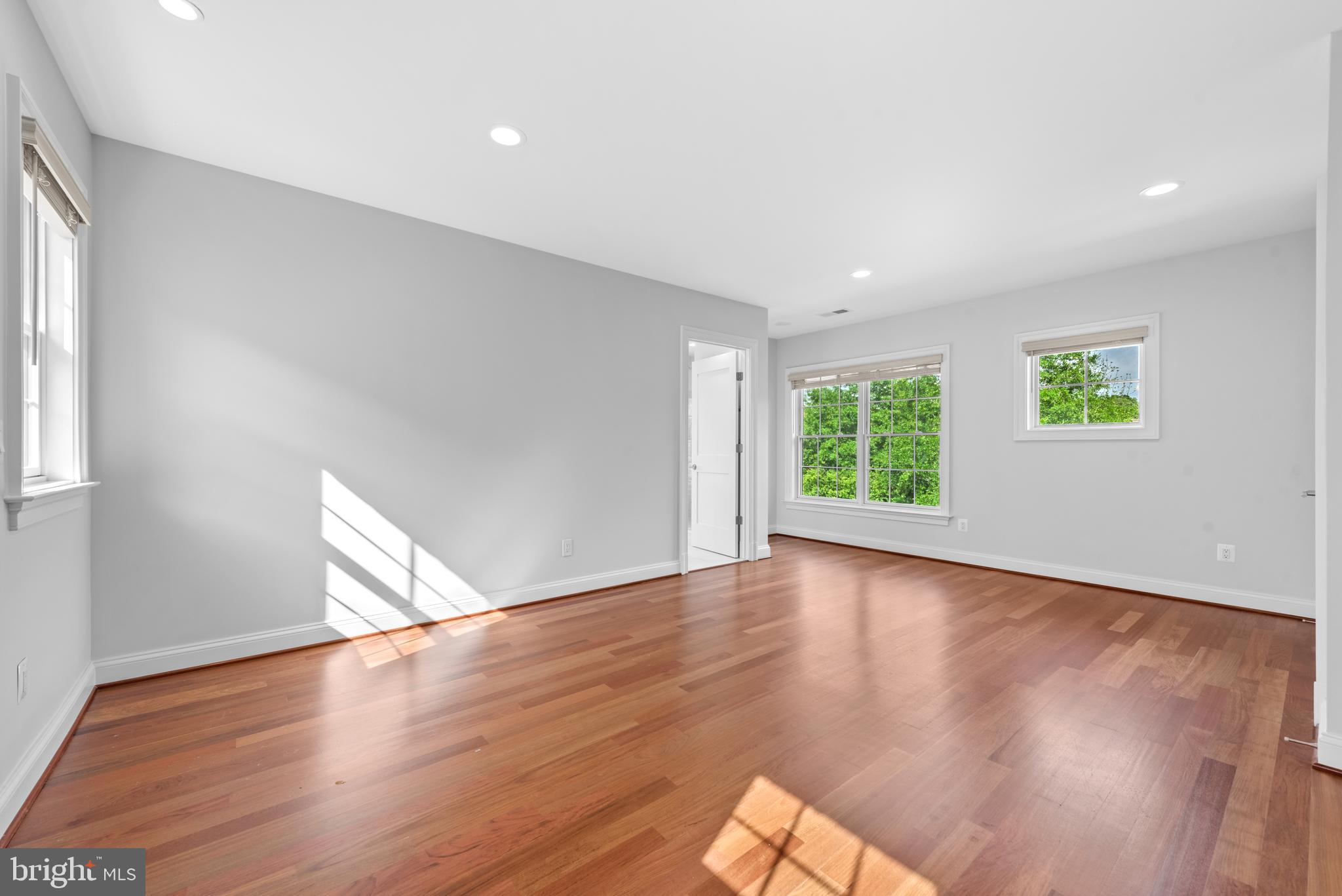 7003 Churchill Road McLean, VA 22101 - Photo 53 of 76 an empty room with wooden floor and windows