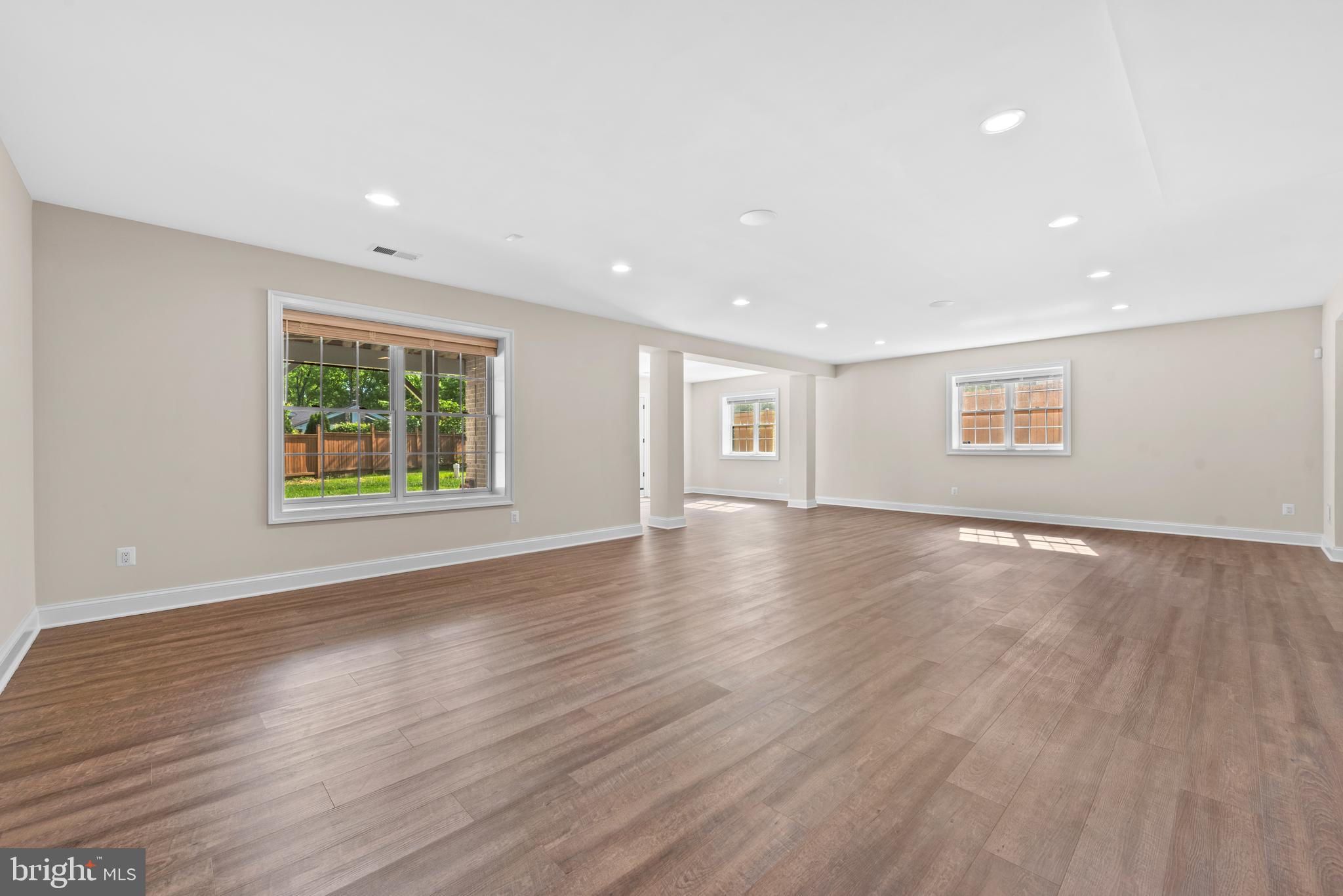 7003 Churchill Road McLean, VA 22101 - Photo 61 of 76 a view of an empty room with wooden floor and windows