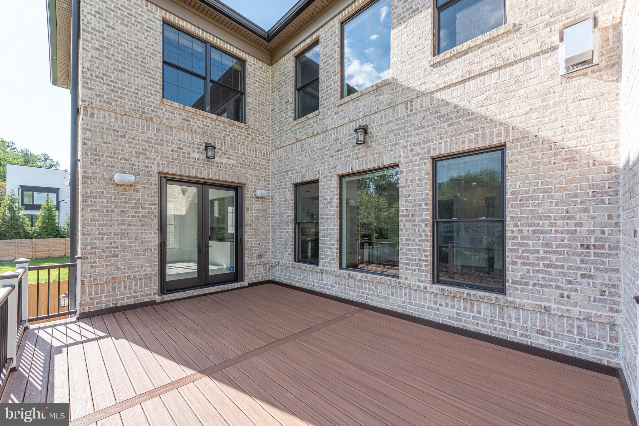 7003 Churchill Road McLean, VA 22101 - Photo 72 of 76 a view of a brick house with large windows