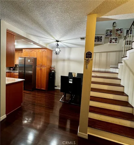 a view of a living room with wooden floor