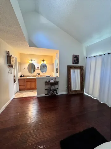 a view of a bathroom with a sink and a mirror