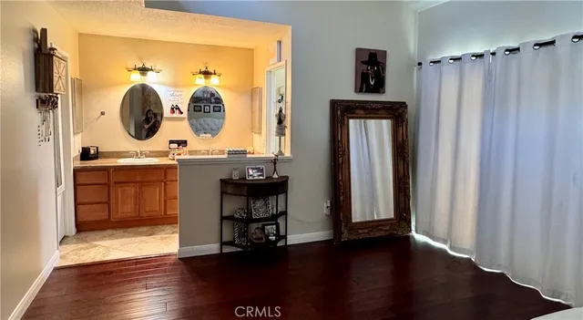 a room with two sink and chairs