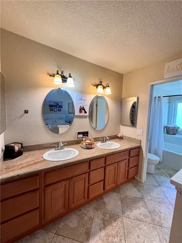 walk in closet with clothes and shoes