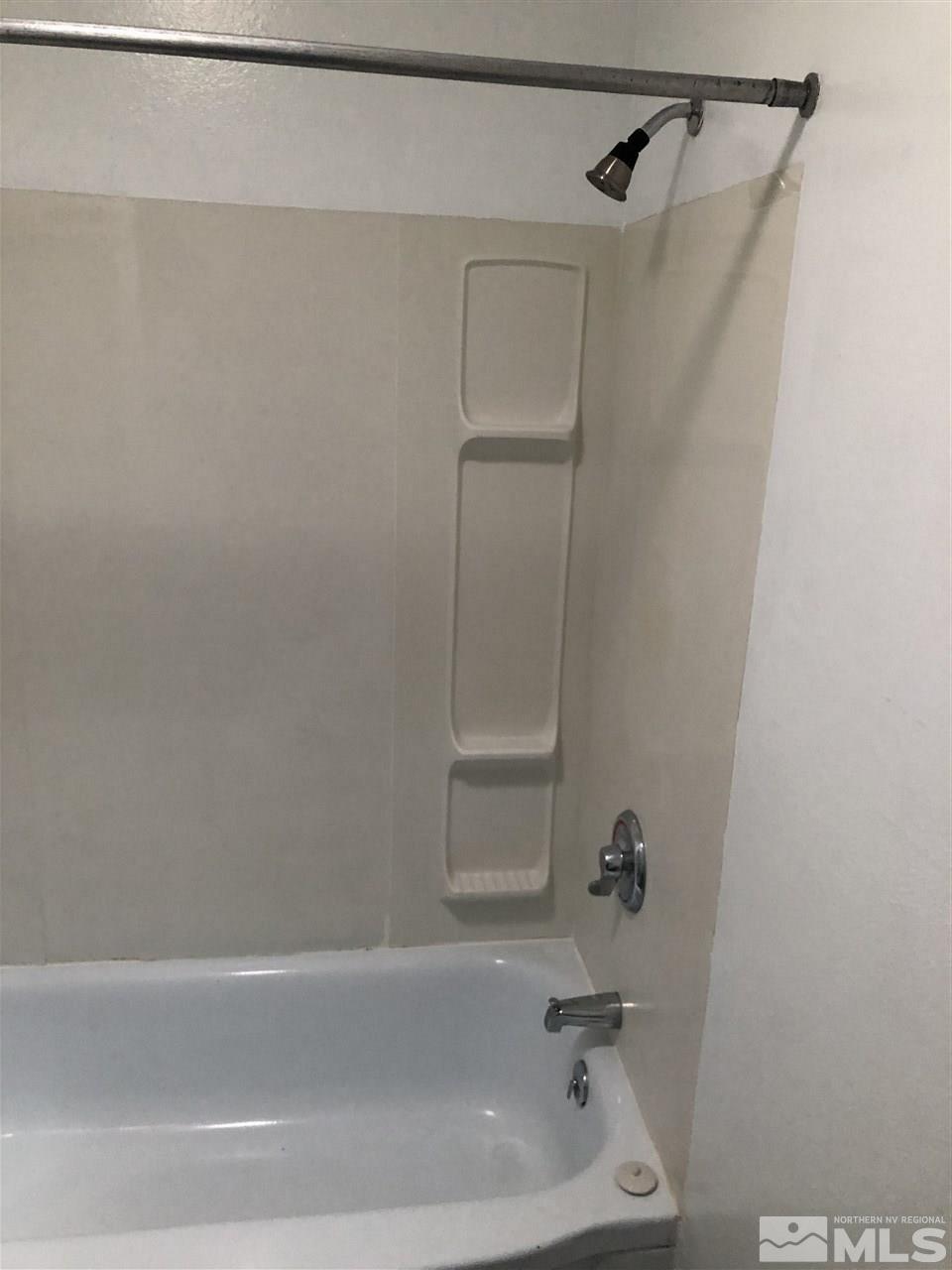 1045 Beldon Way Reno, NV 89503 - Photo 9 of 23 a bathroom with a bathtub