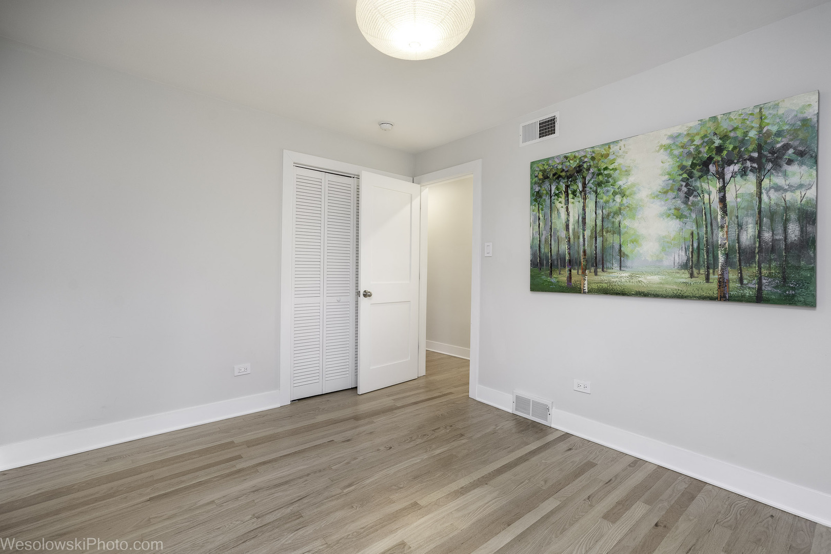 708 North Russel Street Mount Prospect, IL 60056 - Photo 12 of 30 a view of an empty room with wooden floor and a window