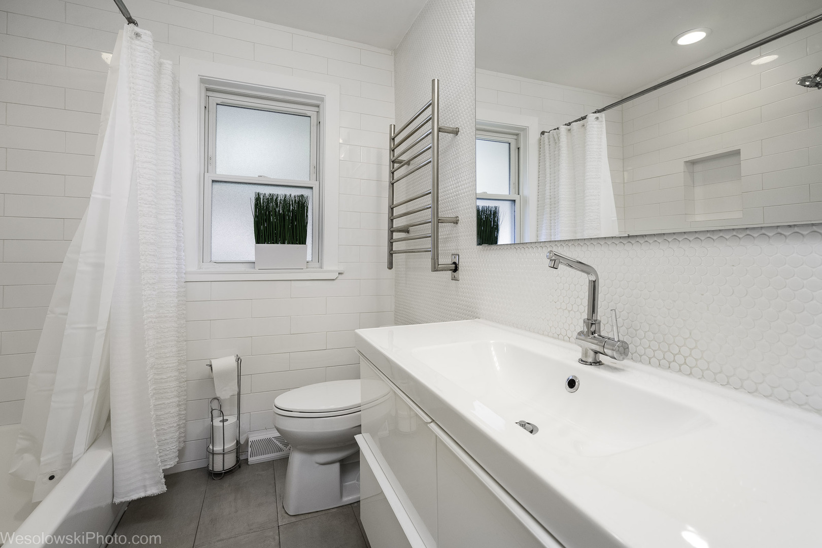 708 North Russel Street Mount Prospect, IL 60056 - Photo 22 of 30 a bathroom with a sink a toilet and a mirror