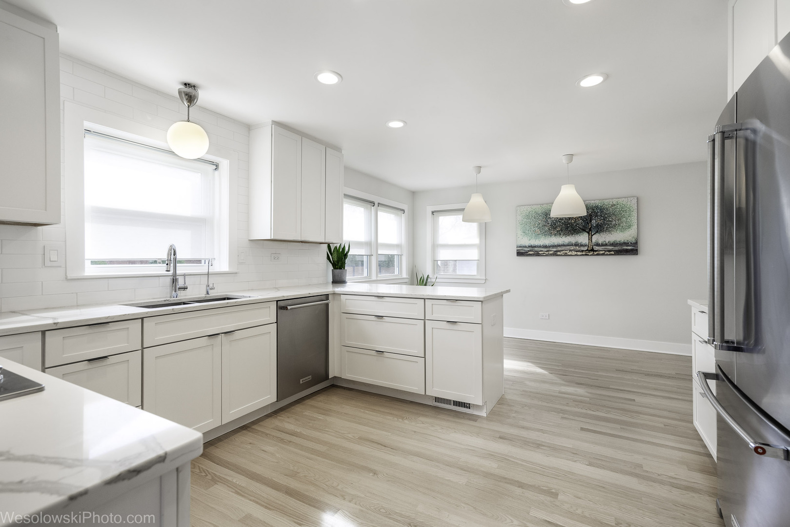 708 North Russel Street Mount Prospect, IL 60056 - Photo 5 of 30 a kitchen with white cabinets and white appliances