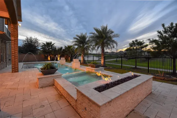 a view of a backyard with sitting area