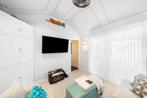 a bedroom with a bed and a couch