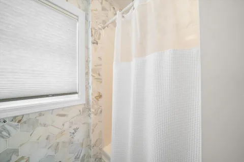 a bathroom with a shower curtain