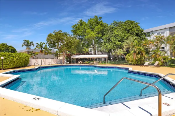 a view of swimming pool with outdoor seating