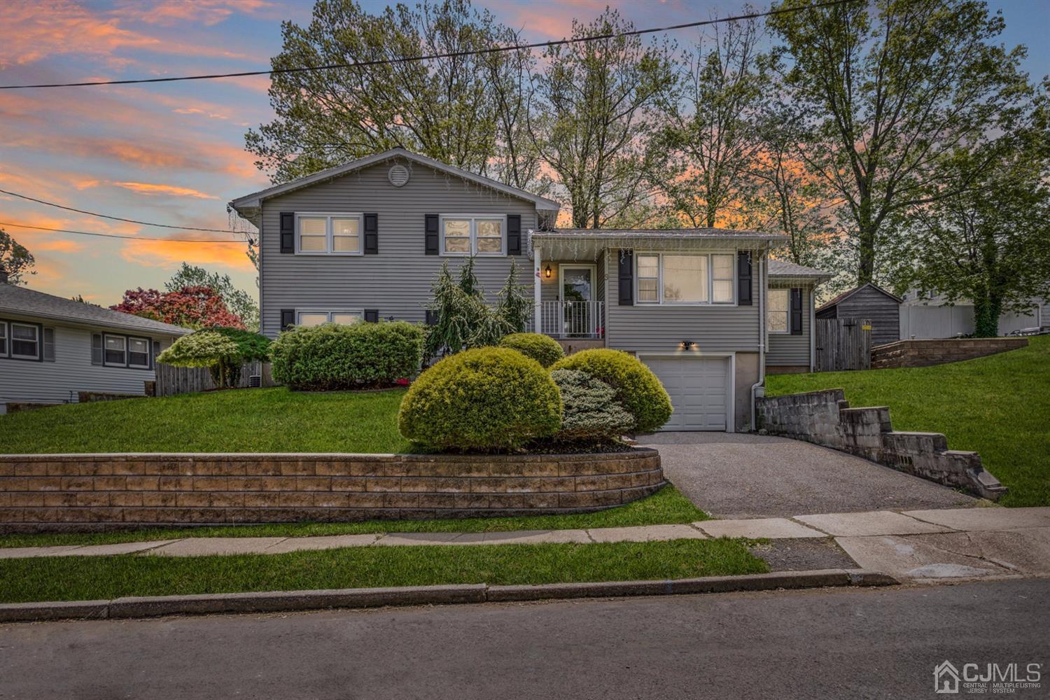 9 Larchmont Road Edison, NJ 08837 - Photo 1 of 31 a front view of a house with a yard