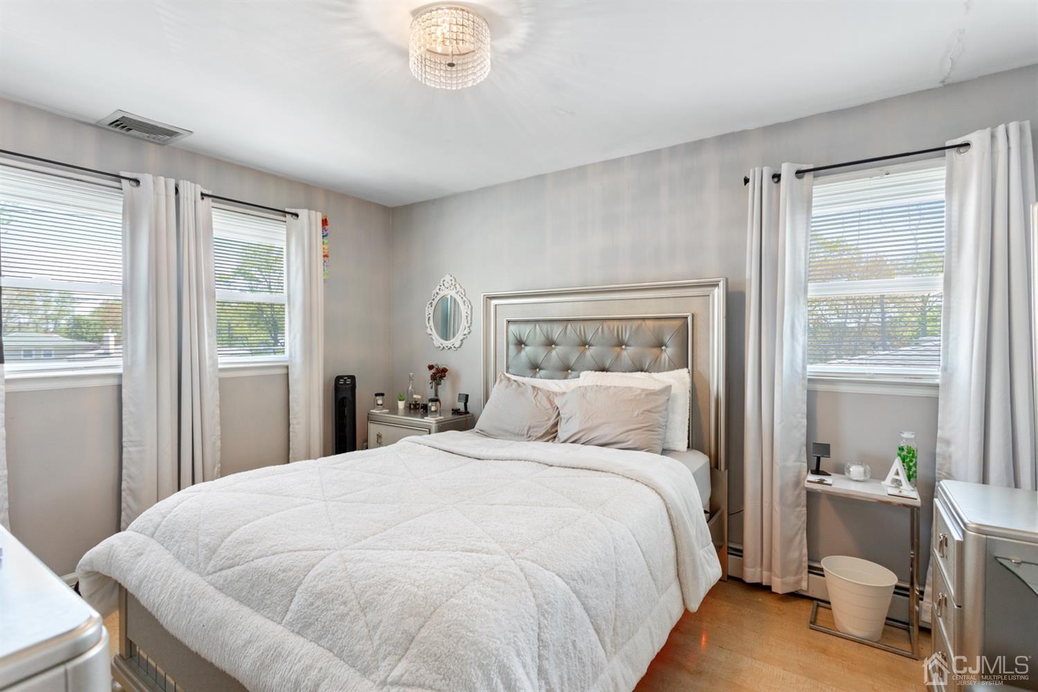 9 Larchmont Road Edison, NJ 08837 - Photo 19 of 31 a bedroom with a large bed and a window