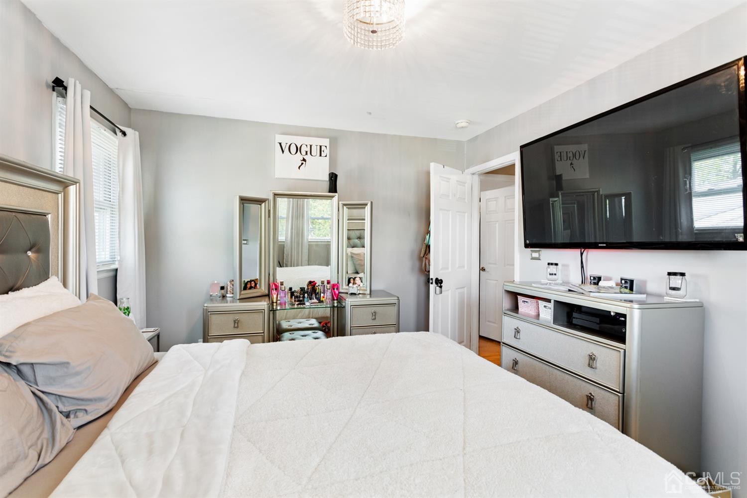 9 Larchmont Road Edison, NJ 08837 - Photo 20 of 31 a bedroom with a bed and a flat screen tv