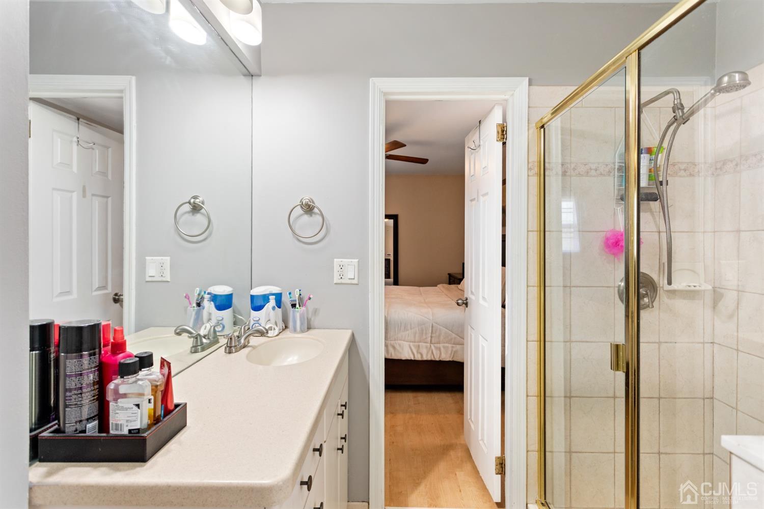 9 Larchmont Road Edison, NJ 08837 - Photo 23 of 31 a en suite bathroom with a sink and a mirror