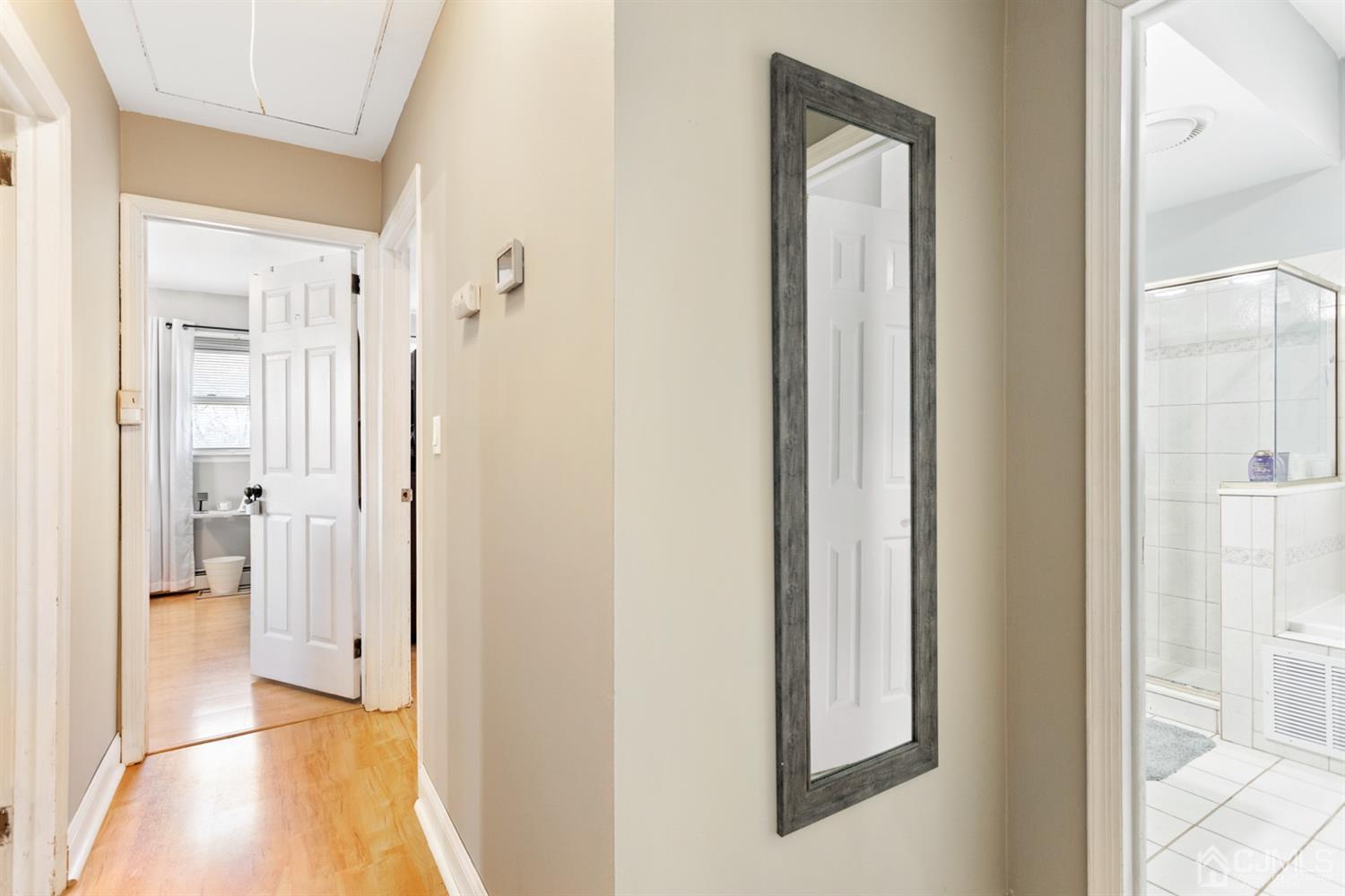 9 Larchmont Road Edison, NJ 08837 - Photo 25 of 31 a view of a bathroom from a hallway