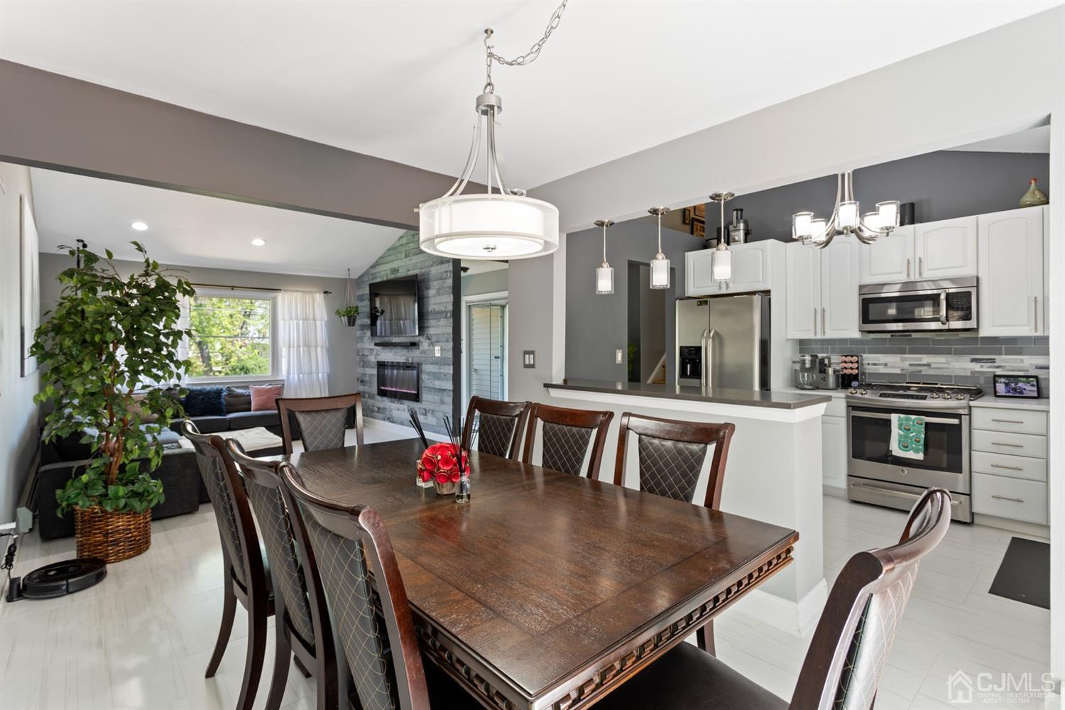 9 Larchmont Road Edison, NJ 08837 - Photo 7 of 31 a view of a dining room with furniture window and wooden floor