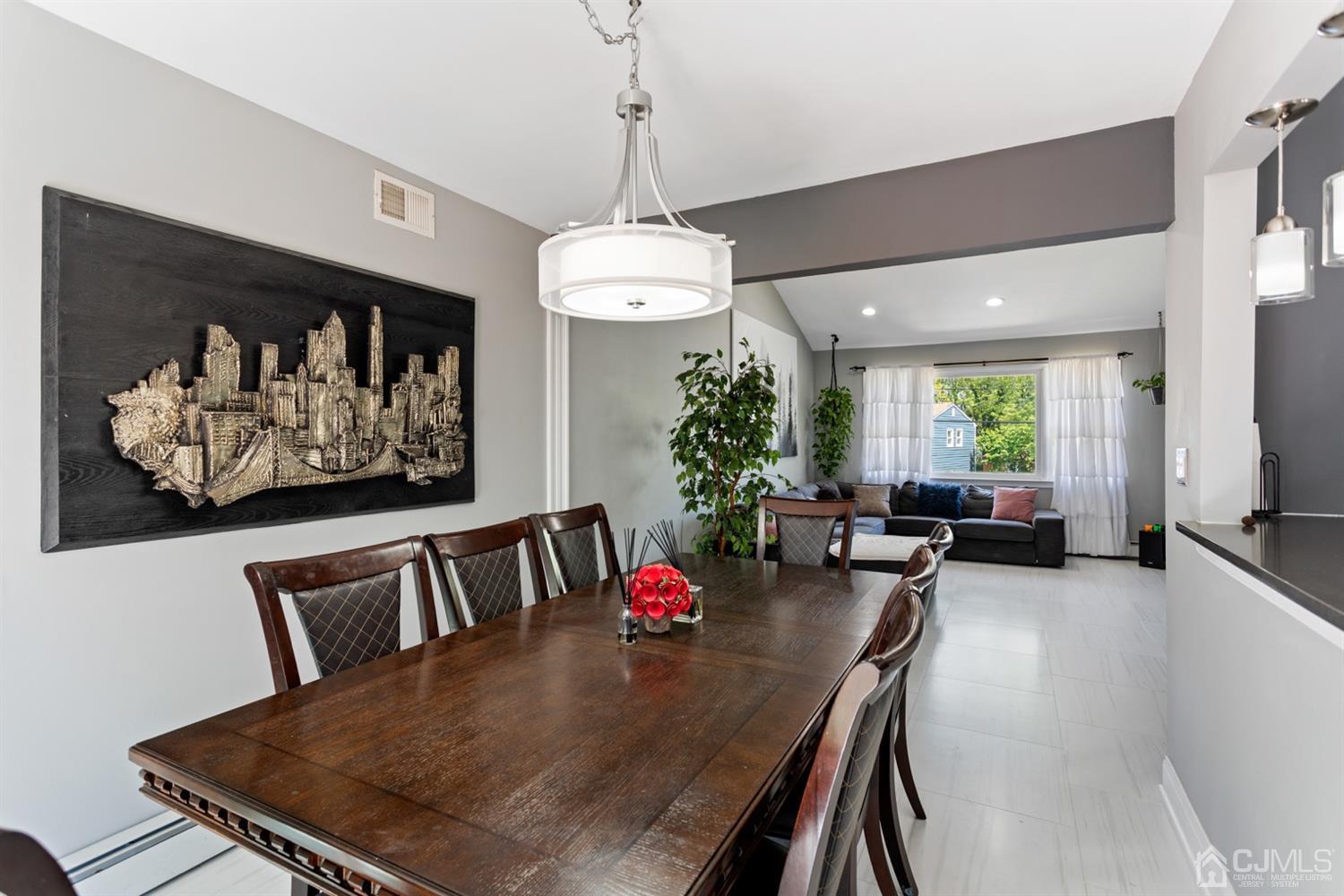 9 Larchmont Road Edison, NJ 08837 - Photo 8 of 31 a view of a dining room with furniture window and wooden floor