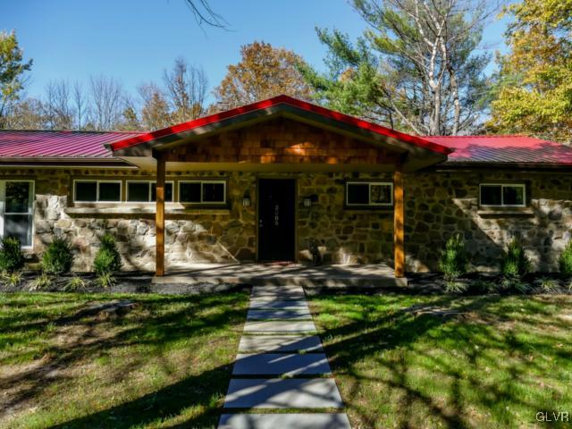 3085 Bursonville Road Riegelsville, PA 18077 - Photo 2 of 31 a front view of a house with garden