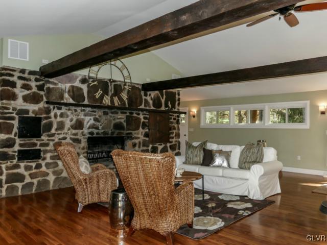 3085 Bursonville Road Riegelsville, PA 18077 - Photo 10 of 31 a living room with a couch and a potted plant