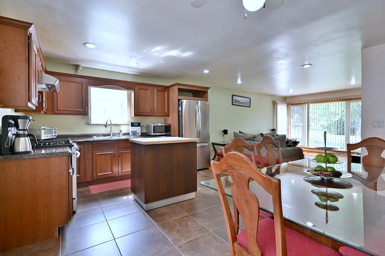 511 West Byron Avenue Addison, IL 60101 - Photo 11 of 31 a large kitchen with stainless steel appliances granite countertop a stove a sink dishwasher and a refrigerator