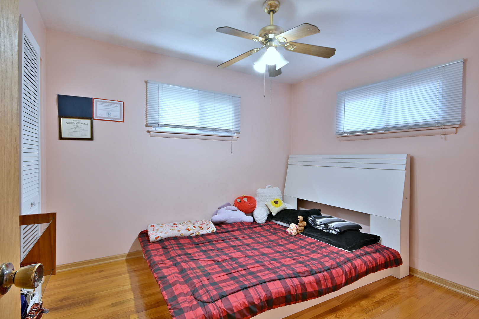 511 West Byron Avenue Addison, IL 60101 - Photo 16 of 31 a bedroom with a bed and a chandelier