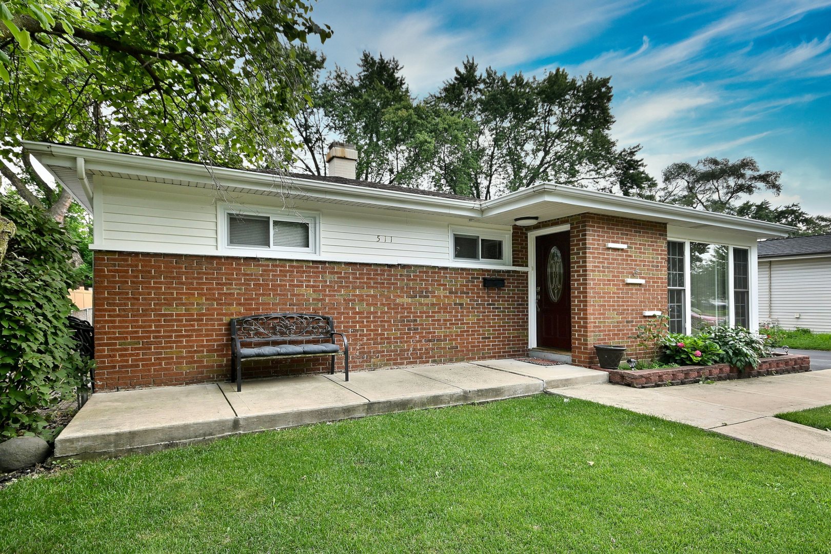 511 West Byron Avenue Addison, IL 60101 - Photo 2 of 31 a front view of a house with a yard