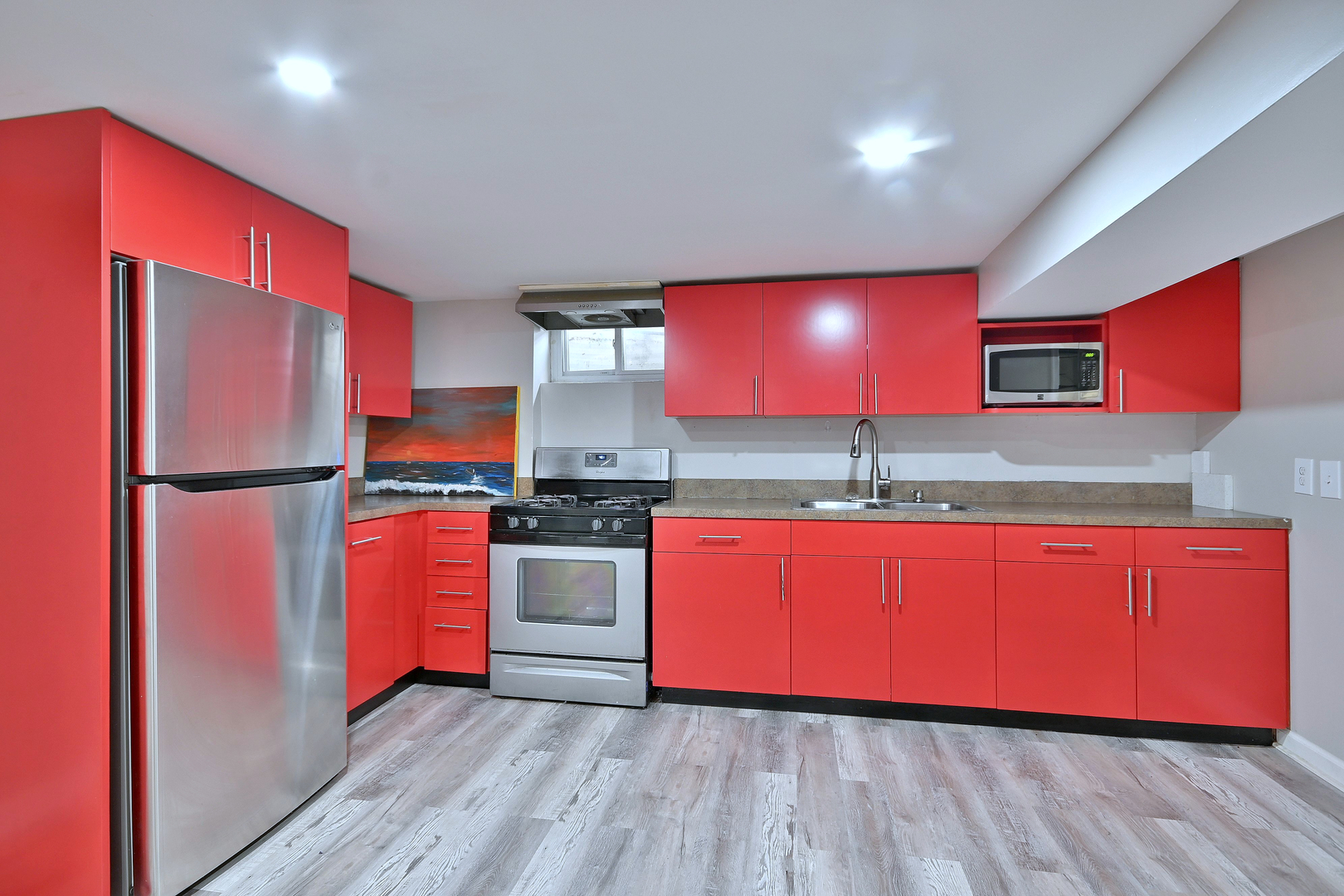 511 West Byron Avenue Addison, IL 60101 - Photo 21 of 31 a kitchen with stainless steel appliances granite countertop a refrigerator a stove top oven and wooden floor