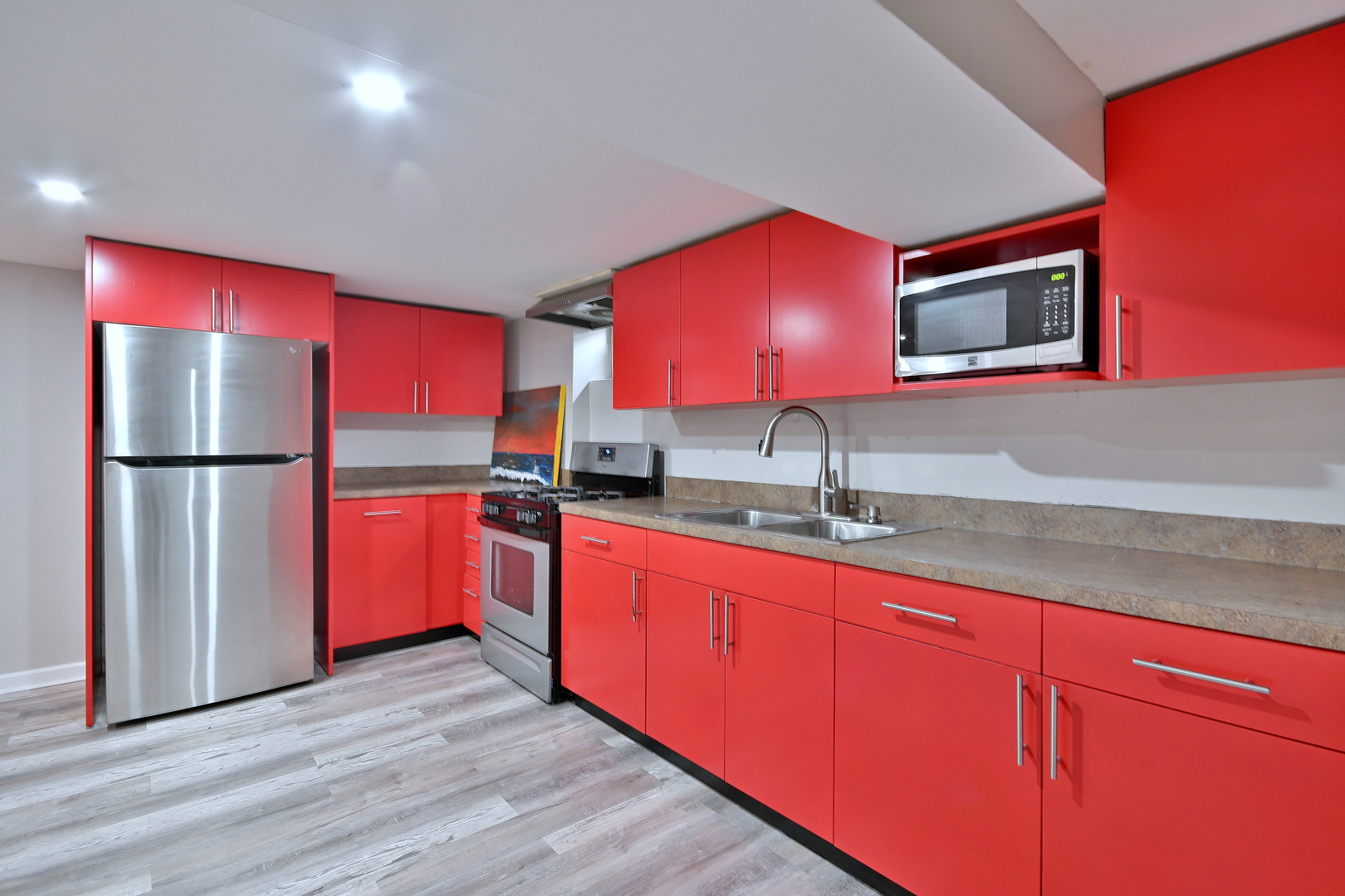 511 West Byron Avenue Addison, IL 60101 - Photo 22 of 31 a kitchen with stainless steel appliances granite countertop a stove a sink and a refrigerator