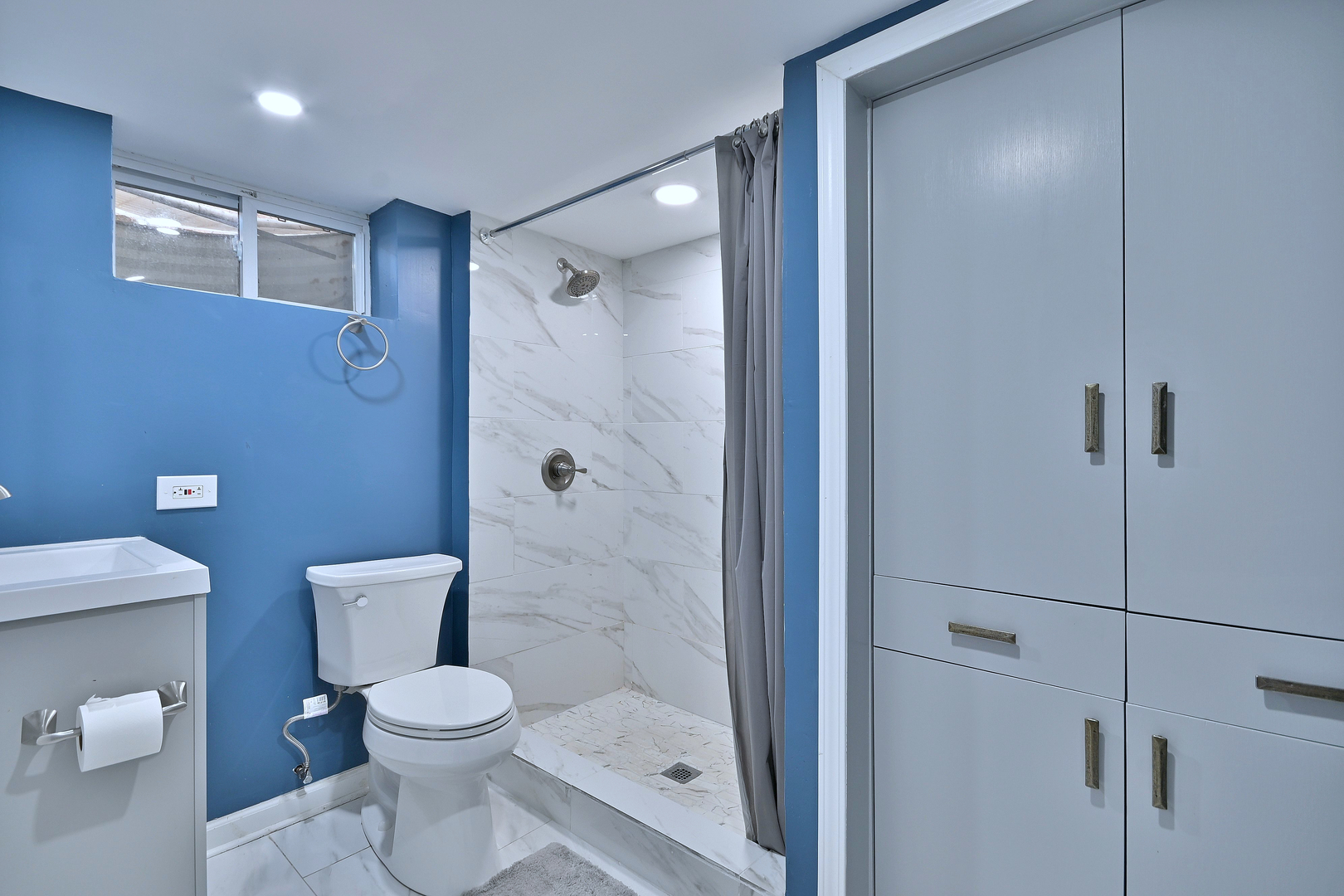 511 West Byron Avenue Addison, IL 60101 - Photo 26 of 31 a white toilet sitting next to a bathroom sink