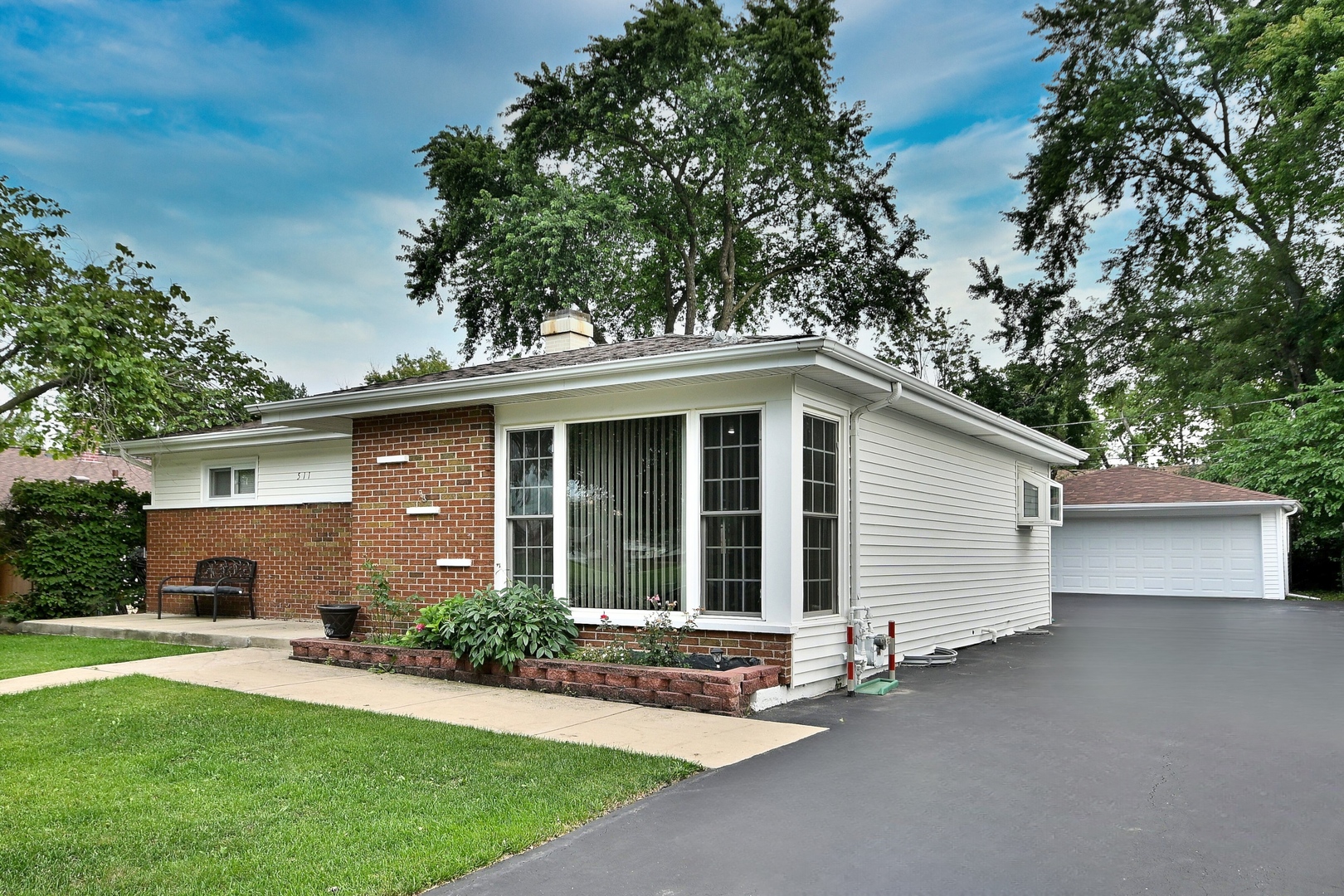 511 West Byron Avenue Addison, IL 60101 - Photo 3 of 31 front view of a house with a garden
