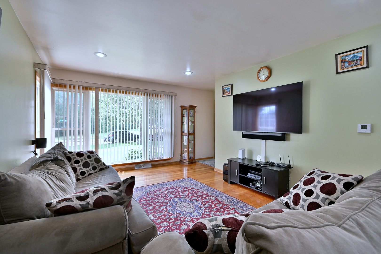 511 West Byron Avenue Addison, IL 60101 - Photo 4 of 31 a living room with furniture and a flat screen tv