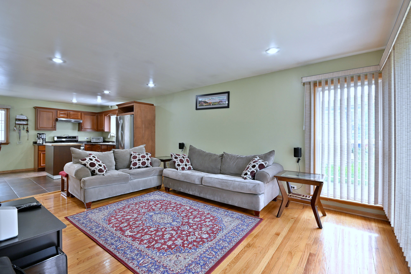 511 West Byron Avenue Addison, IL 60101 - Photo 5 of 31 a living room with furniture and a rug