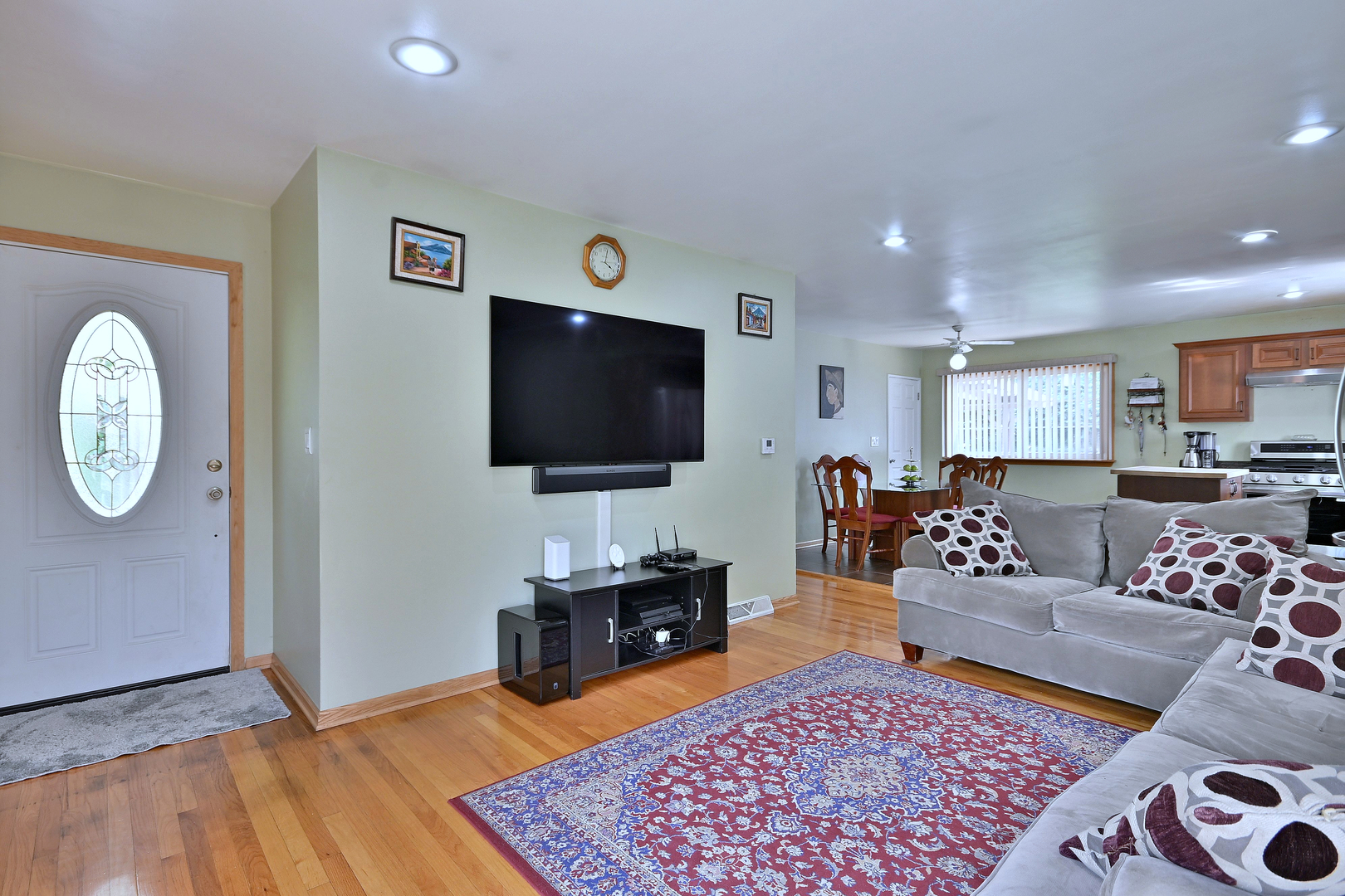 511 West Byron Avenue Addison, IL 60101 - Photo 7 of 31 a living room with furniture and a flat screen tv