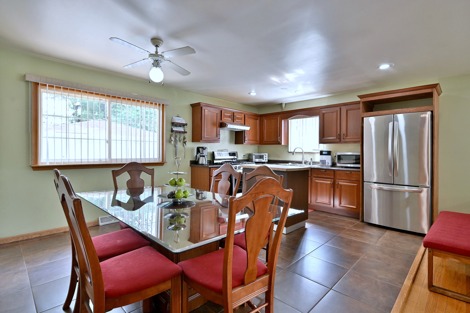 511 West Byron Avenue Addison, IL 60101 - Photo 9 of 31 a view of a dining room with furniture a kitchen and chandelier