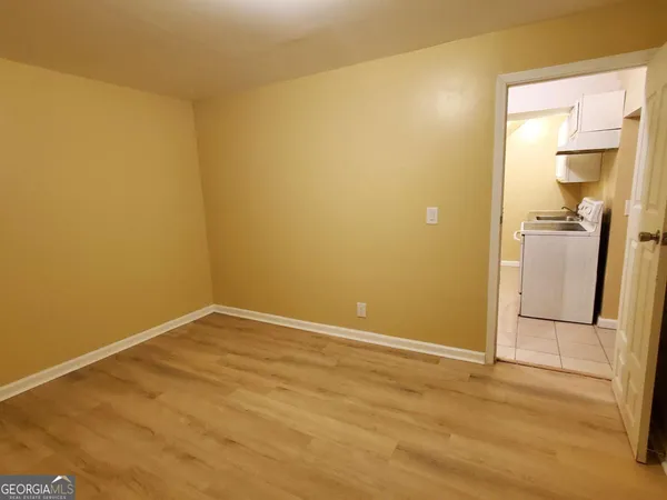 an empty room with a mirror