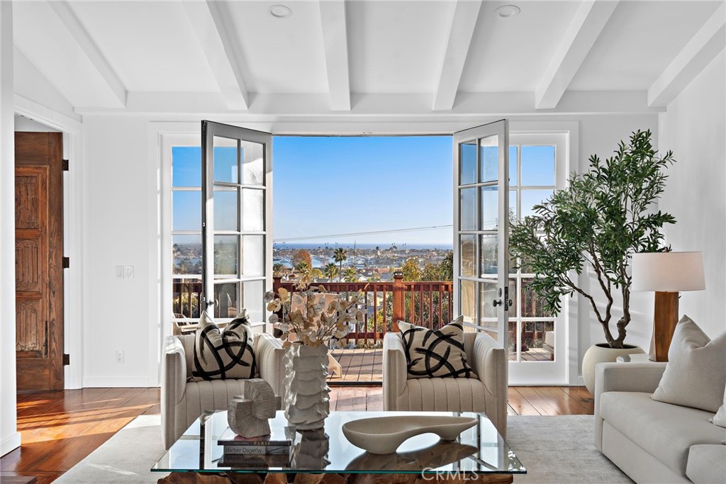 521 Kings Road Newport Beach, CA 92663 - Photo 16 of 48 a view of a living room with furniture and floor to ceiling window