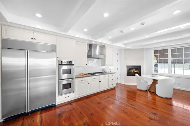 a large kitchen with a lot of counter space and appliances