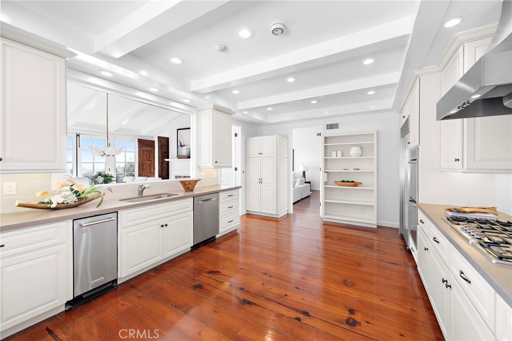 521 Kings Road Newport Beach, CA 92663 - Photo 20 of 48 a large kitchen with a lot of counter space and appliances