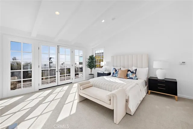 a bedroom with a bed and a fireplace