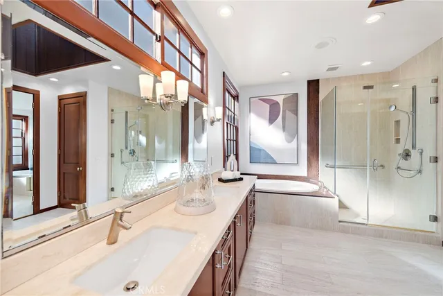 a bathroom with a double vanity sink and a mirror