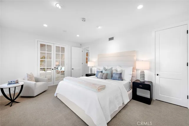 a living room with fireplace furniture and a large window